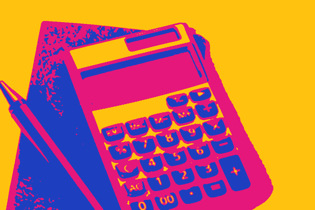 A calculator and a pen on a notebook.